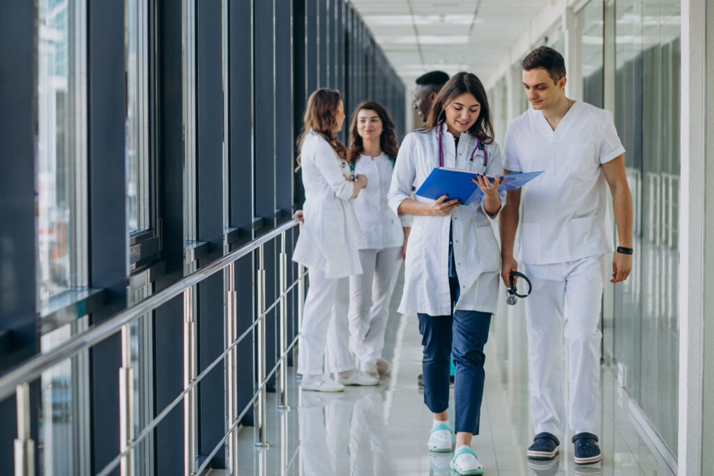 team-young-specialist-doctors-standing-corridor-hospital